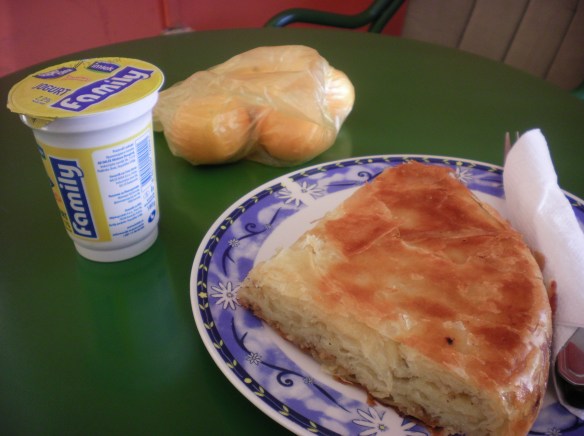 My favorite Serbia breakfast, "Burek" and yogurt. Layers filo dough, with cheese and meat., fresh out of the oven