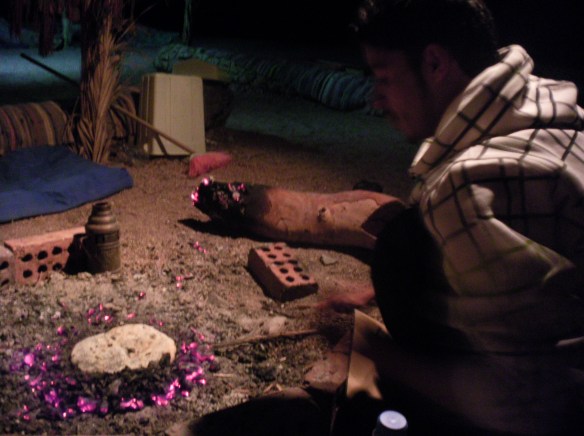 Salah, my Bedouin friend makes me tobania, fire bread with spices