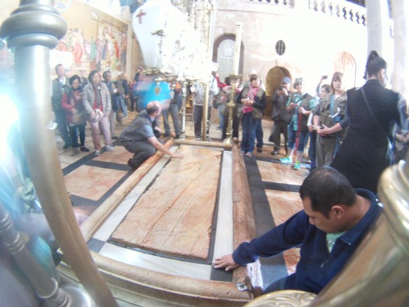 Crucifixion site, this stone was repeatedly kissed, every 10 minutes a lady would wipe it clean with a rag and disinfectant  