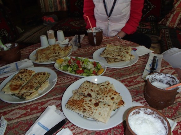 Eastern Turkish Cuisine, Gozleme, fresh bread with eggplant and cheese, very similar to a quesadilla. Washed down with ayran, the salty Turkish Lassie equivalent.