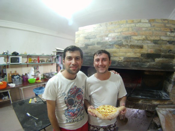 Some friendly Georgians showing off a freshly made acharuli 