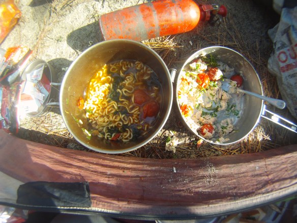 An interesting breakfast, ramen noodles mixed with kimchi, tuna fish, seaweed and cherry tomatoes