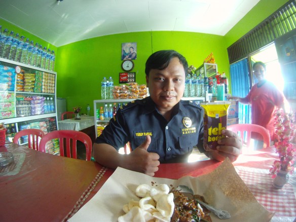 My friend from the Tarakan Customs office (We became friends after my bags were searched thoroughly for drugs) He was courteous though and bought me Gado Gado, Rice with peanut sauce and Sago chips to welcome me to the country